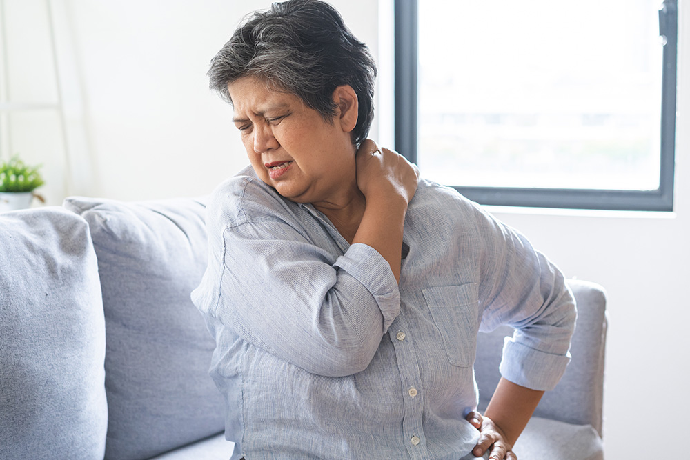 Senior woman with stenosis of the spine in pain.