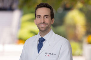 A portrait of Dr. Michael Safaee in a white medical coat.